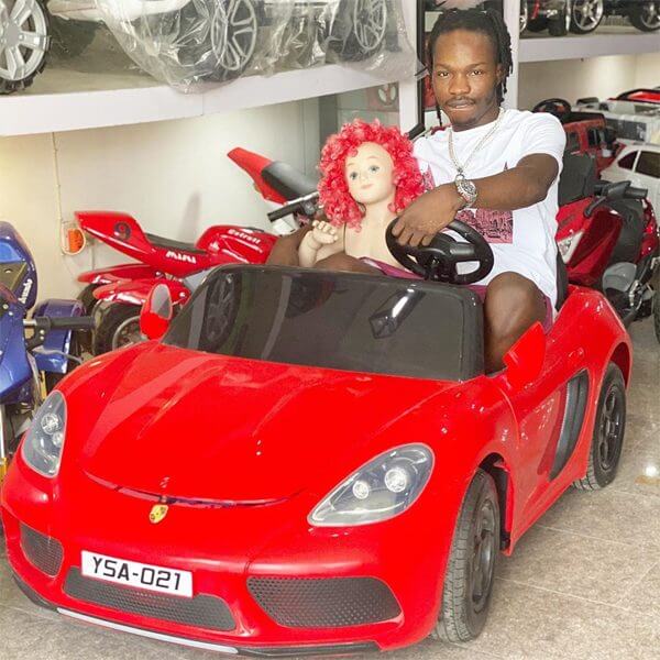 NairaMarley with Toy Porsche