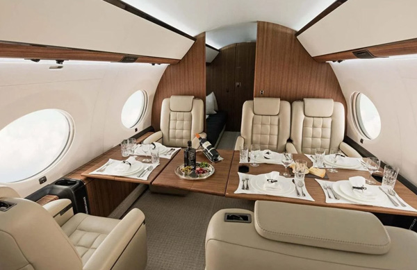 The G650ER has room to include a dining table across the cabin