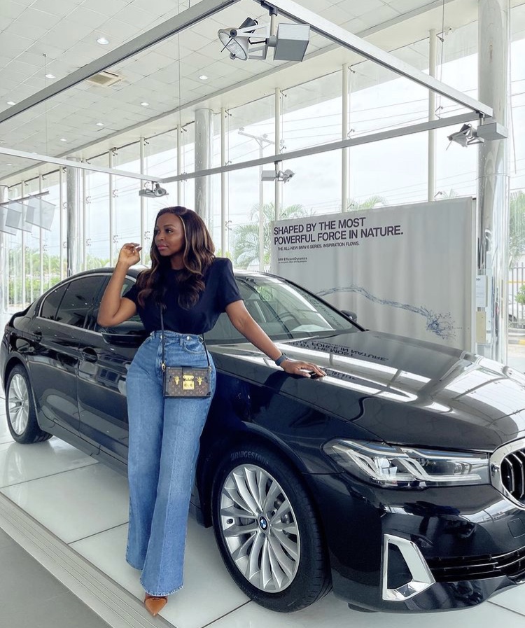 Sandrah standing next to the BMW 5 series
