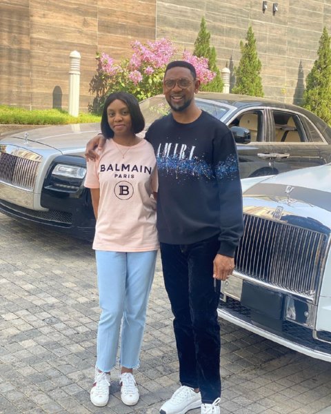 Biodun Fatoyinbo posing with his daughter and two Rolls Royce