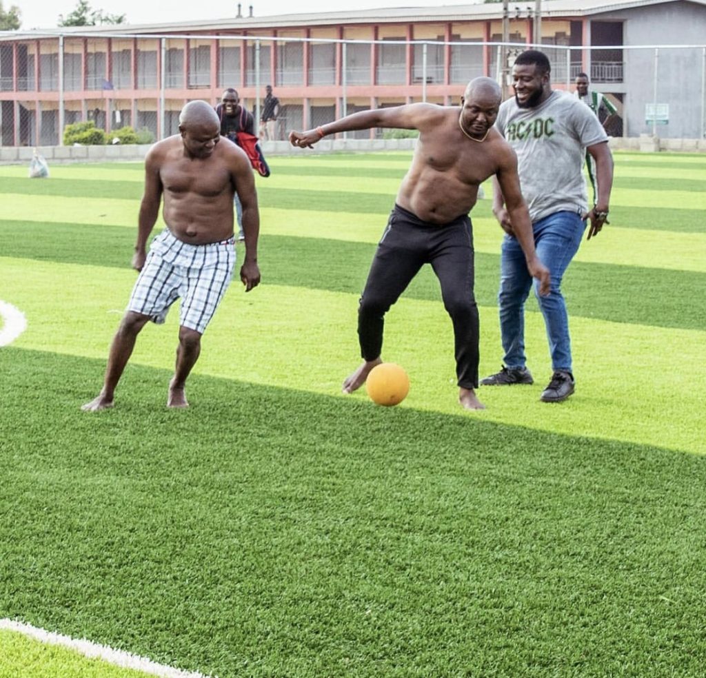 Akin Alabi playing football at the pitch he commissioned