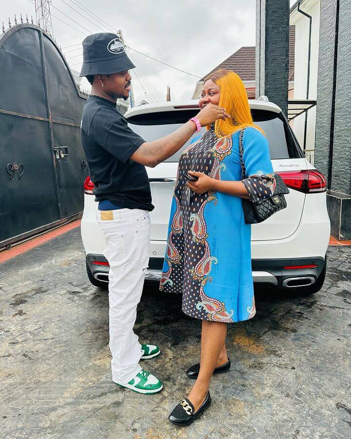 Blord and wife pictured with 2022 Mercedes Benz GLE 450