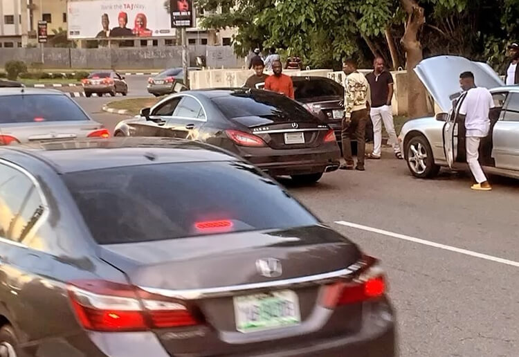 Man Surprised to Find the Rare Mercedes CLS63 AMG, Rushes to Take Pictures of the Luxury Car in Abuja